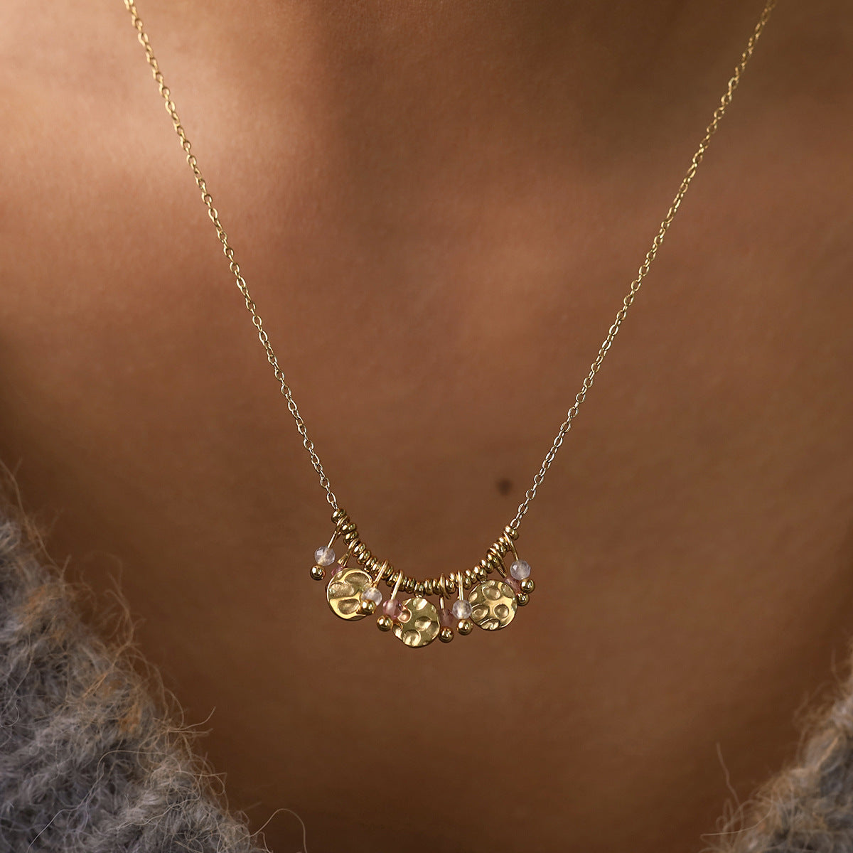Model wearing gold earthy boho style natural stone necklace for summer