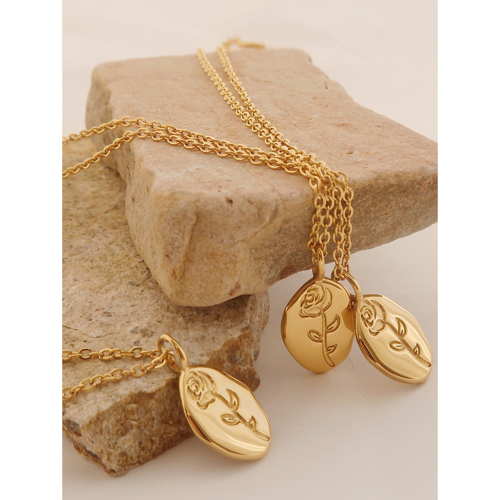 Gold rose flower pendant necklace on model - CC Jewelry
