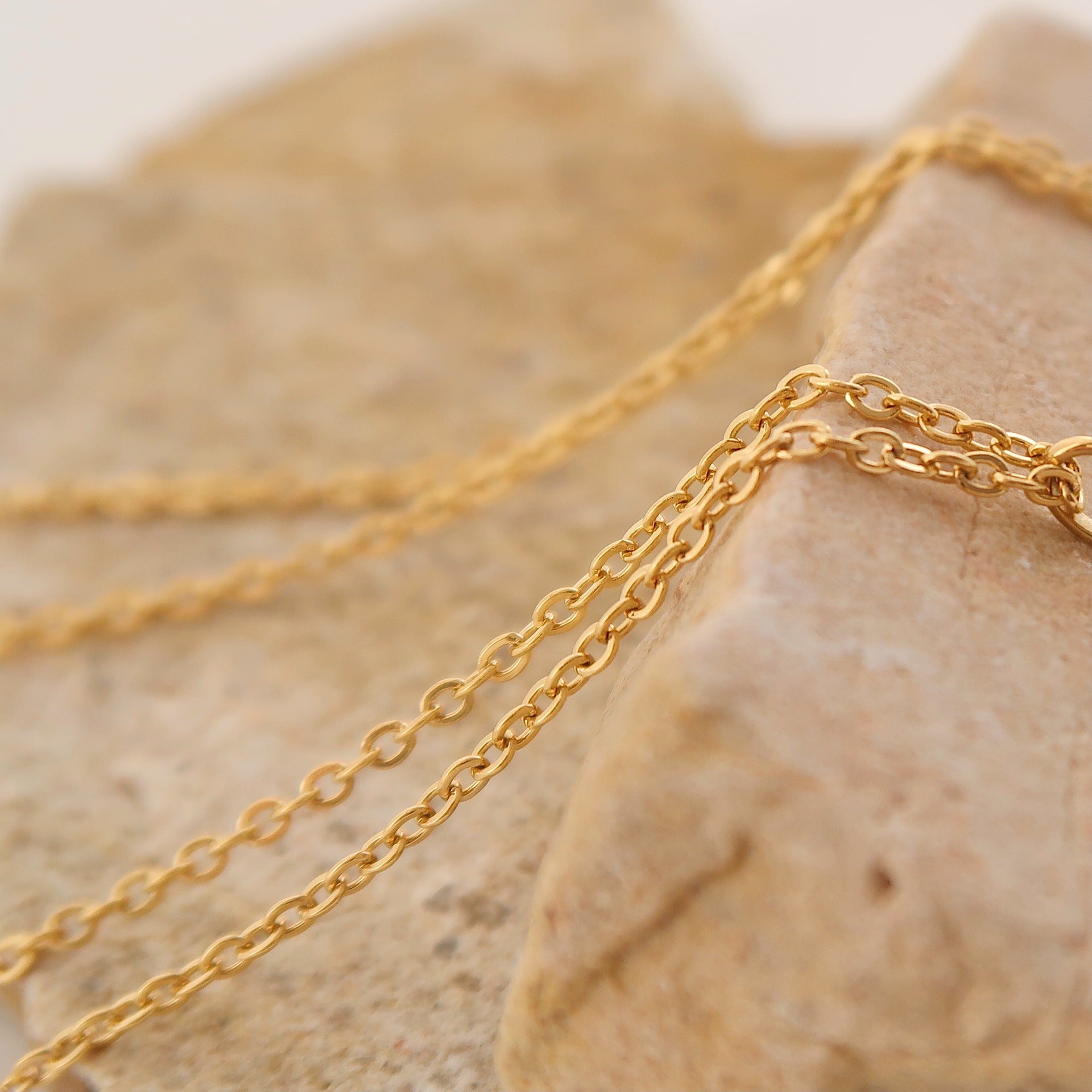 Gold rose flower pendant necklace on model - CC Jewelry
