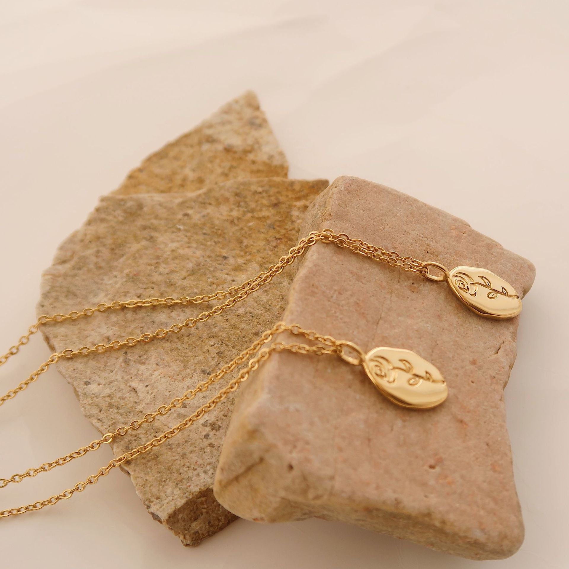 Gold rose flower pendant necklace on model - CC Jewelry