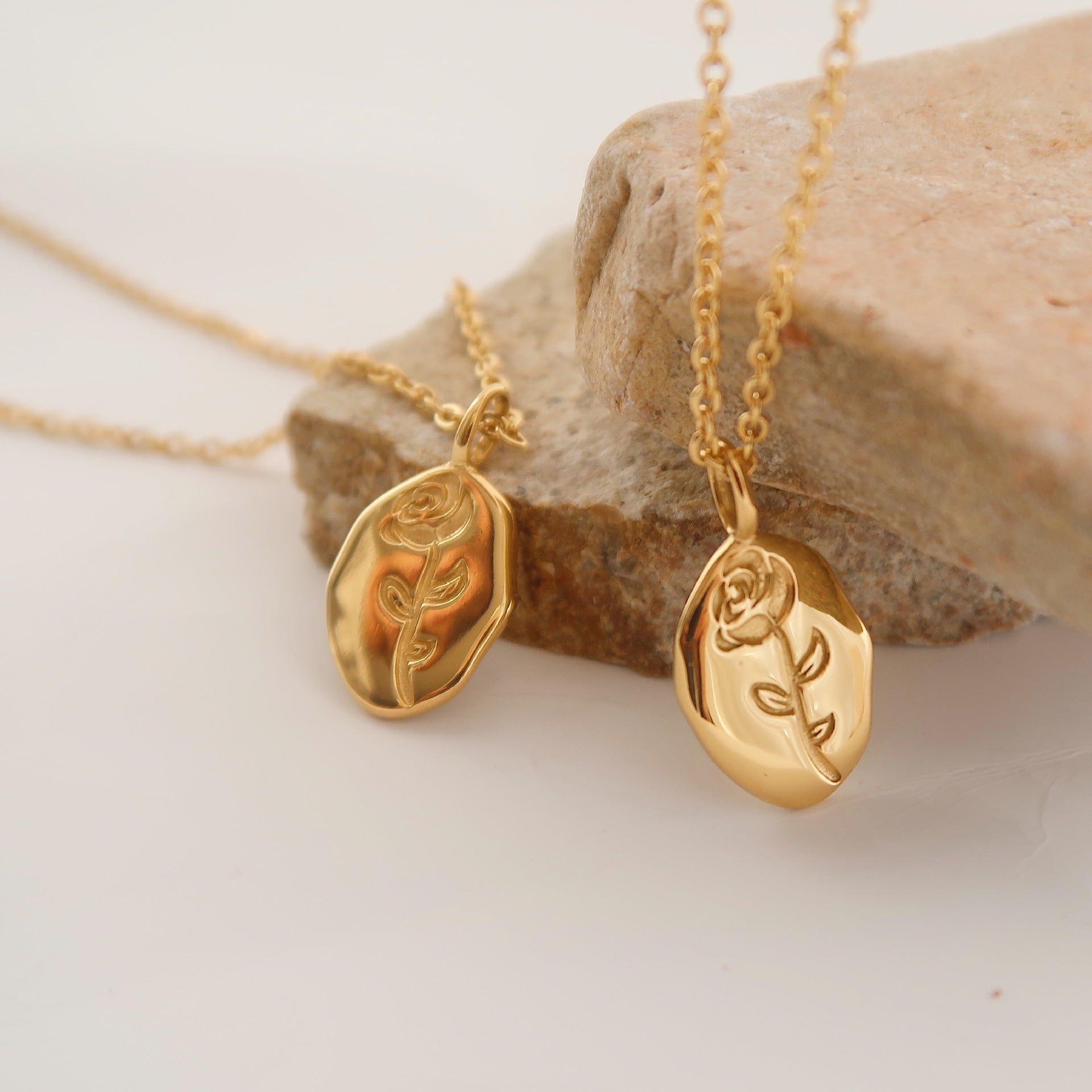 Gold rose flower pendant necklace on model - CC Jewelry