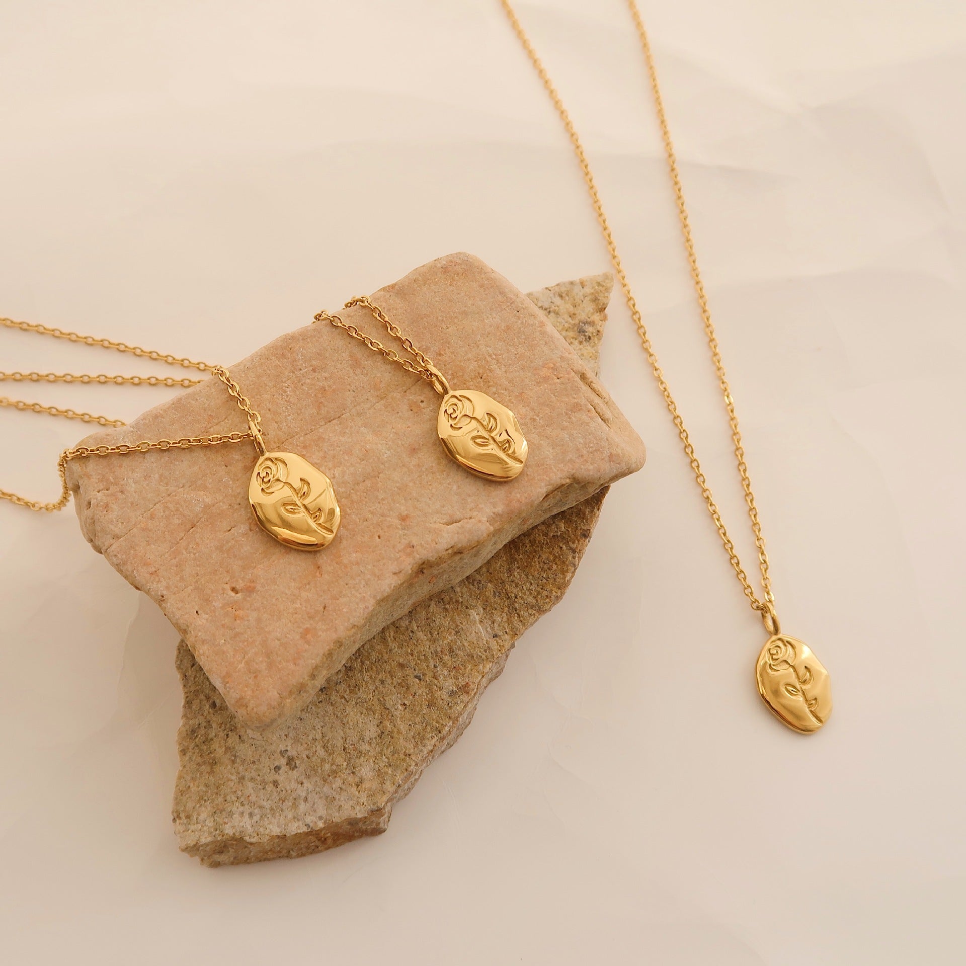 Gold rose flower pendant necklace on model - CC Jewelry
