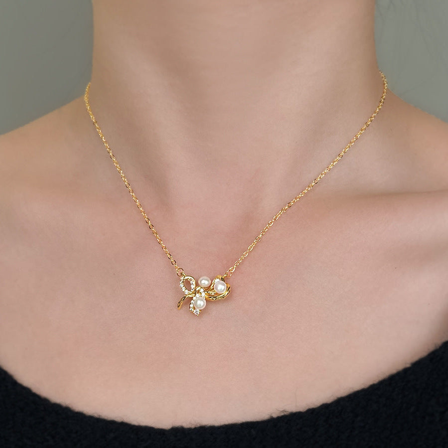 Dainty French bow knot detail on tarnish-free gold pearl choker