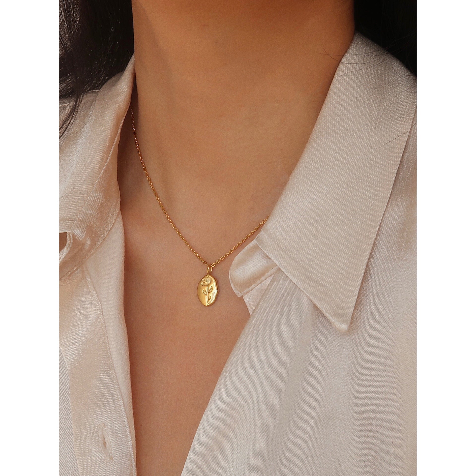 Gold rose flower pendant necklace on model - CC Jewelry