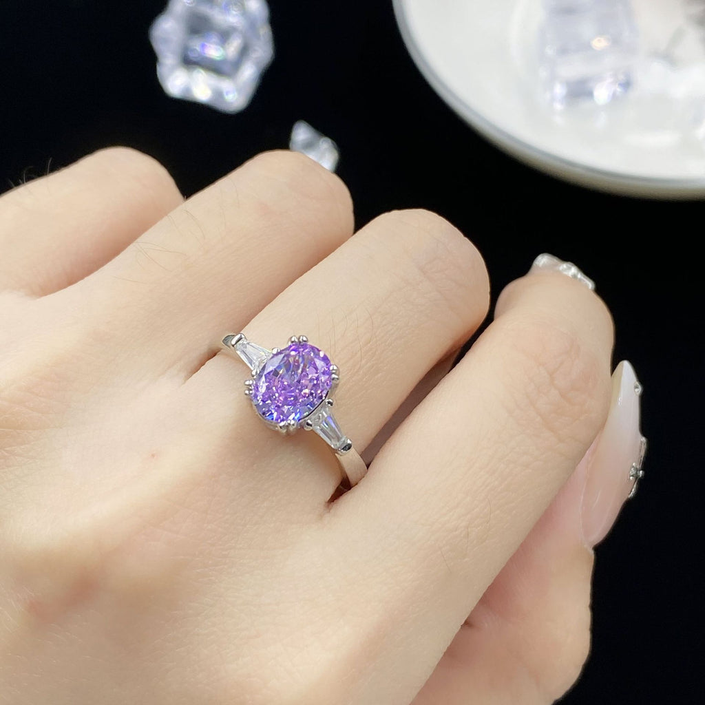 Flourescent color-changing purple zircon ring with adjustable open band design